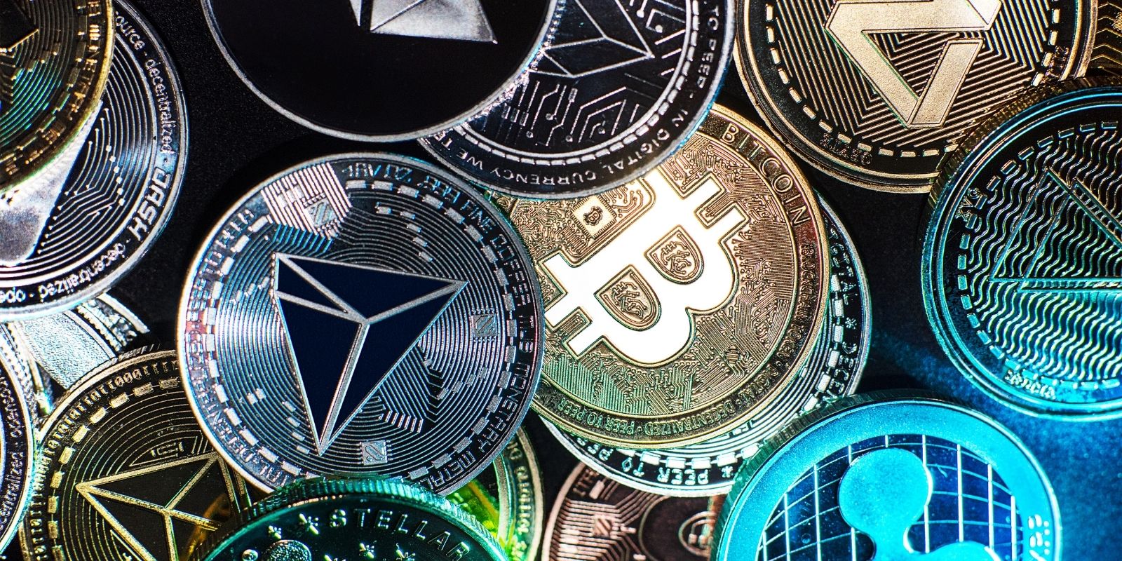 Different cryptocurrencies displayed as digital coins, including Bitcoin and Ethereum, representing roarcultable latest crypto trends from riproar