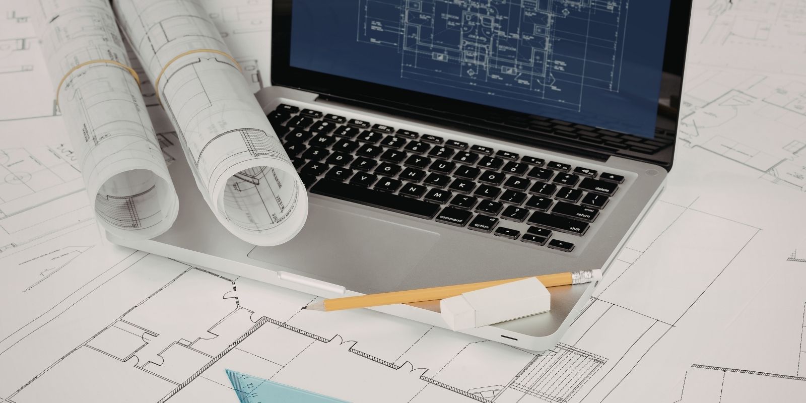 IT support for architects team optimizing CAD software and BIM systems within a modern architecture firm office, maintaining secure IT infrastructure, network solutions, and data backup systems.